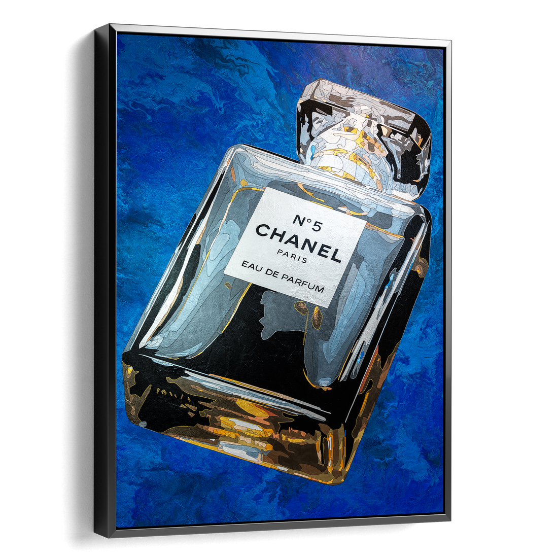 Framed artwork of a Chanel No. 5 perfume bottle on a blue abstract background