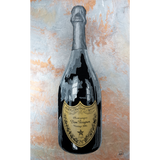 Bottle of Dom Perignon champagne on a textured background