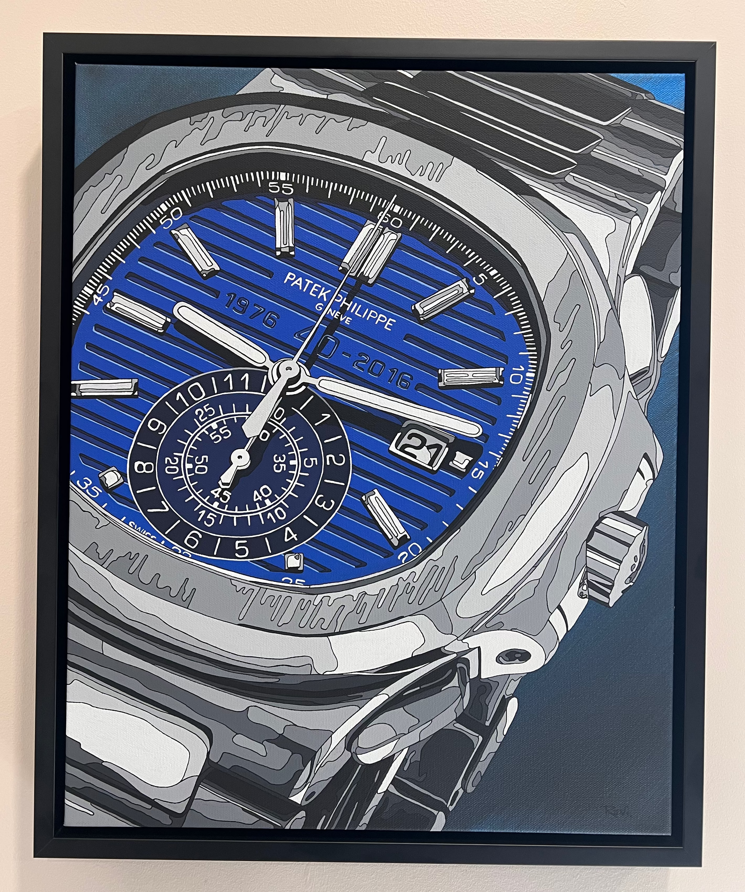 Framed artwork of a Patek Philippe watch with a blue face