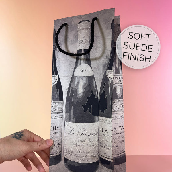Wine-themed gift bag with a soft suede finish on a gradient background